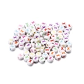 Macro detail of white acrylic letter beads with colorful X print for DIY jewelry making - Style X / 7mm (100 Pieces/Pack)