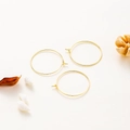 Detailed view of 18K gold plated minimalist hoop earrings on a natural aesthetic backdrop - 15mm / 10 Pieces Pack / 14K Gold