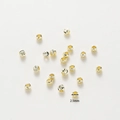 Macro view of 2.5mm 18K gold-plated copper beads with detailed spiral carved textures - 2.5mm (1mm Hole) 20 Pieces/Pack / 14K Gold