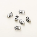 Macro view of six silver butterfly ear backs with a polished mirror finish for jewelry - 50 Pieces/Pack (3.5x5mm) / White Gold
