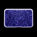 Macro shot of irregular deep purple glass stones in a transparent storage box - Blue