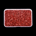 Macro shot of metallic red glass crushed stone in a transparent organizer box - Light Red