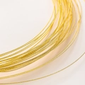 Macro shot of gold-plated twisted wire with textured pattern for jewelry making - 0.5mm Faceted Wire (2m) / 18K Color-preserving Genuine Gold