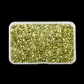 Macro view of gold irregular crushed glass stones in clear box for nail art and DIY crafts - Metallic Green