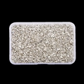 Detailed top view of irregular silver glitter glass stones for nail art in a plastic box - Silver