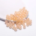 Macro shot of iridescent peach acrylic beads with pearlescent finish for DIY jewelry - Iridescent Round Bead / 8mm (50pcs/Pack) / Orange