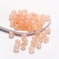 Iridescent champagne acrylic faceted beads for DIY jewelry making displayed on white background - Pearlescent Polyhedron / 10mm (30 Pieces/Pack) / Orange
