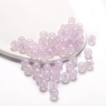 Macro detail of lavender iridescent acrylic round beads for DIY jewelry making - Iridescent Round Bead / 10mm (30 Pieces/Pack) / Purple
