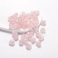 Macro detail of pearlescent pink heart-shaped acrylic beads with DIY threading holes - Pearlescent Heart Style / 30 Pcs/Pack / Pink