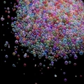 Macro shot of iridescent mixed-size glass bubbles for DIY crafts and nail art decor - Random Mixed Colors