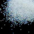 Macro shot of iridescent rainbow glass bubble beads for DIY nail art and resin crafts - 1.5-2mm Iridescent Transparent
