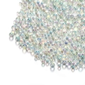 Macro shot of iridescent mermaid glass micro beads for nail art and DIY crafts - White