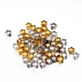 Close-up of gold and silver star-shaped CCB spacer beads with holes for DIY jewelry making - Star / 100pcs Pack / Multicolor