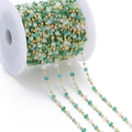 DIY jewelry chain with green crystal cube beads and gold metal links on a spool - Green Colored (Imitation Gold Chain)