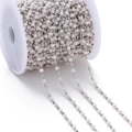 Detail of pink square crystal beads and silver beads on a spool for DIY jewelry making - Cream Colored (Rhodium Chain)