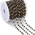 Detail of DIY jewelry chain with gold beads and black crystal cubes on a white spool - Black (Imitation Gold Chain)