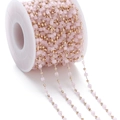 Detail of pink crystal beads and gold metal balls on a bulk jewelry making chain - Pink Jade-like (KC Gold Chain)