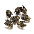 Macro shot of 6 antique bronze filigree flower bead caps for DIY jewelry making - 2 Pcs/Pack / Bronze Style 1