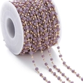 Detail view of purple matte cube beads and gold metal round beads on a large white spool - Purple (KC Gold Chain)