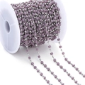 Detailed view of purple resin cube beads and silver metal beads on a white spool - Purple (Rhodium Chain)