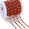 Detail view of red square beads and gold metal beads on a spool for DIY jewelry making - Red (Imitation Gold Chain)