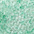 Macro detail of mint green heart glass beads with glitter for DIY jewelry making - 20 Pieces/Pack (Approx 4g) / Green