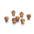 Macro detail of natural maple wood beads with unique wood grain for DIY jewelry - 18mm