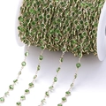 Detail van groene zirkonia kralen aan een gouden ketting voor doe-het-zelf sieraden - Pakket van 1 Meter (6.8mm) / KC Goud Ketting Fruitgroene Zirconia