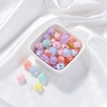 Close-up of frosted acrylic heart beads in macaron colors for DIY jewelry crafts - Transparent Heart Core Bead