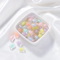 Macro view of colorful frosted acrylic double-layer beads in a white ceramic bowl - Transparent Multi-faceted Column Core Bead