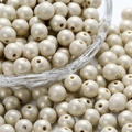 Detailed macro of 8mm-12mm macaron pearl acrylic beads in a glass bowl for DIY jewelry - Silver Gray