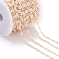 Macro view of gold metal beads and pink cylinder beads chain on a white spool - Rectangular Stone Bead Style / 1 Meter / Beige (Gold Chain)