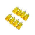 Detailed view of eight yellow translucent resin gummy bear charms with golden glitter - Transparent Yellow Orange