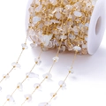 Macro shot of natural crystal chips and golden square beads on a DIY jewelry spool - Opal Chip Stone Gold Tone Chain / 2mm (1 Meter/Pack)