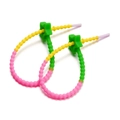 Macro detail of gradient star silicone cable tie with macaron colors and textured surface - Green