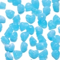 Macro shot of 5-8mm sky blue acrylic heart beads with center holes for DIY crafts - 50 Pieces / Blue