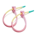Macro detail of gradient star silicone cable ties and DIY backpack charms accessories - Pink 2