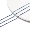 Macro shot of 2mm dark blue rhinestone tennis chain with silver metal claw setting - 2.0mm (1m/Pack) / Silver Base Capri Blue
