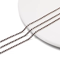 Close-up of 2mm dark red rhinestone claw chain on white ceramic plate for DIY jewelry craft - 2.0mm (1m/Pack) / Silver Base Dark Coffee