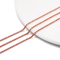 Close-up of 2mm orange-red rhinestone chain with silver metal base for DIY jewelry making - 2.0mm (1m/Pack) / Silver Base Coral Red