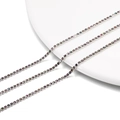 Macro detail of 2mm rainbow rhinestone tennis chain with silver-tone four-claw settings - 2.0mm (1m/Pack) / Silver Base Multicolor
