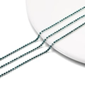 Macro detail of 2mm dark green rhinestone tennis chain with silver-tone claw setting - 2.0mm (1m/Pack) / Silver Base Peacock Green