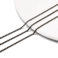 Macro detail of 2mm dark grey rhinestone claw chains for DIY jewelry making and crafts - 2.0mm (1m/Pack) / Black Base Transparent Gray
