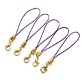 Close-up of five purple braided lanyards with shiny gold lobster clasps for DIY jewelry - Deep purple
