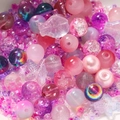 Macro detail of mixed pink and purple DIY glass beads in heart and star shapes - 20g/Pack (2-8mm) / Sakura Pink