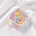 Colorful floral acrylic beads in a white bowl for DIY jewelry making accessories - Transparent Rose Core Bead