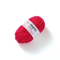 Close-up of soft rose pink 4-ply milk cotton yarn ball with white paper label on white base - Deep Rose Red