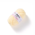 Detailed close-up of cream 4-ply milk cotton yarn ball with Liliarage branding label - Light Yellow