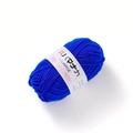 Close-up of royal blue milk cotton yarn roll with white LILIARGE brand label for crochet - Sapphire Blue