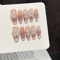 Unghie finte cat eye rosa con fiori 3D, perle e strass su punte ovali lunghe ed eleganti - Extra Piccolo (XS) / Ovale Lungo
